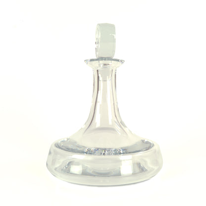 Garrafa Clipper da Vista Alegre em vidro transparente, reinterpretando a histórica garrafa de Vinho do Porto do século XVIII com base larga, pescoço curto e design naval.